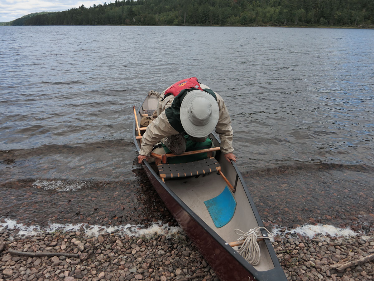 Disembarking from the canoe at McManus Lake on the Petawawa River in Algonquin Park