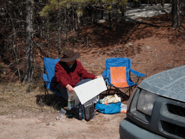 map reading along the Achray Road in Algonquin Park in early spring