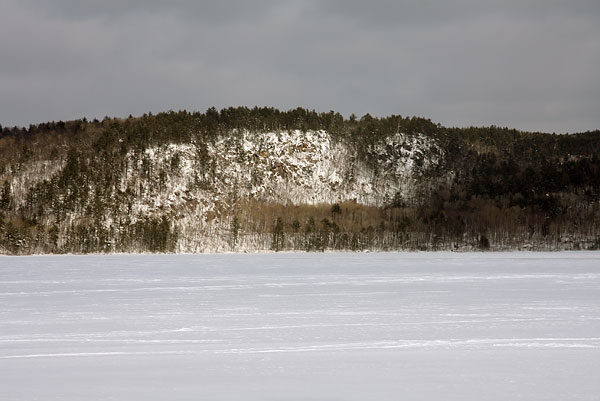 Cliff on Quebec shore of Ottawa River as seen from Balmers Bay