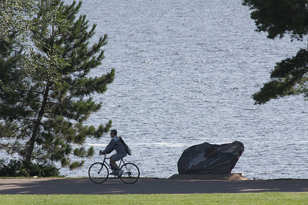 Cyclist at Centennial Rock along the Deep River Waterfront