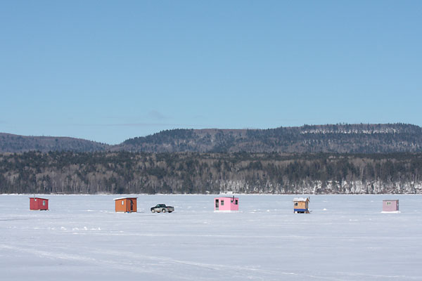 ice fishing huts off the Deep River Pier