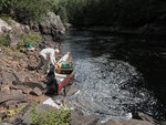 Launching canoe below the first part of Natch Rapids on the Petawawa River in Algonquin Park