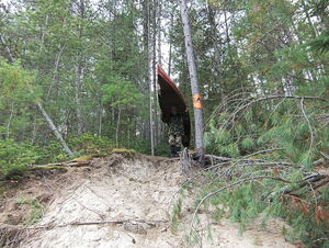 Exploring Five Mile Rapids  portaging from the portage trail down the sand bank to the river