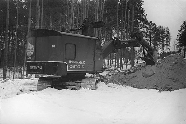 digging for new water mains on Laurier Ave in Deep River  January 1954