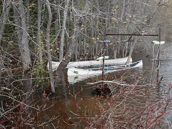 two awash canoes at the Deep River Pier